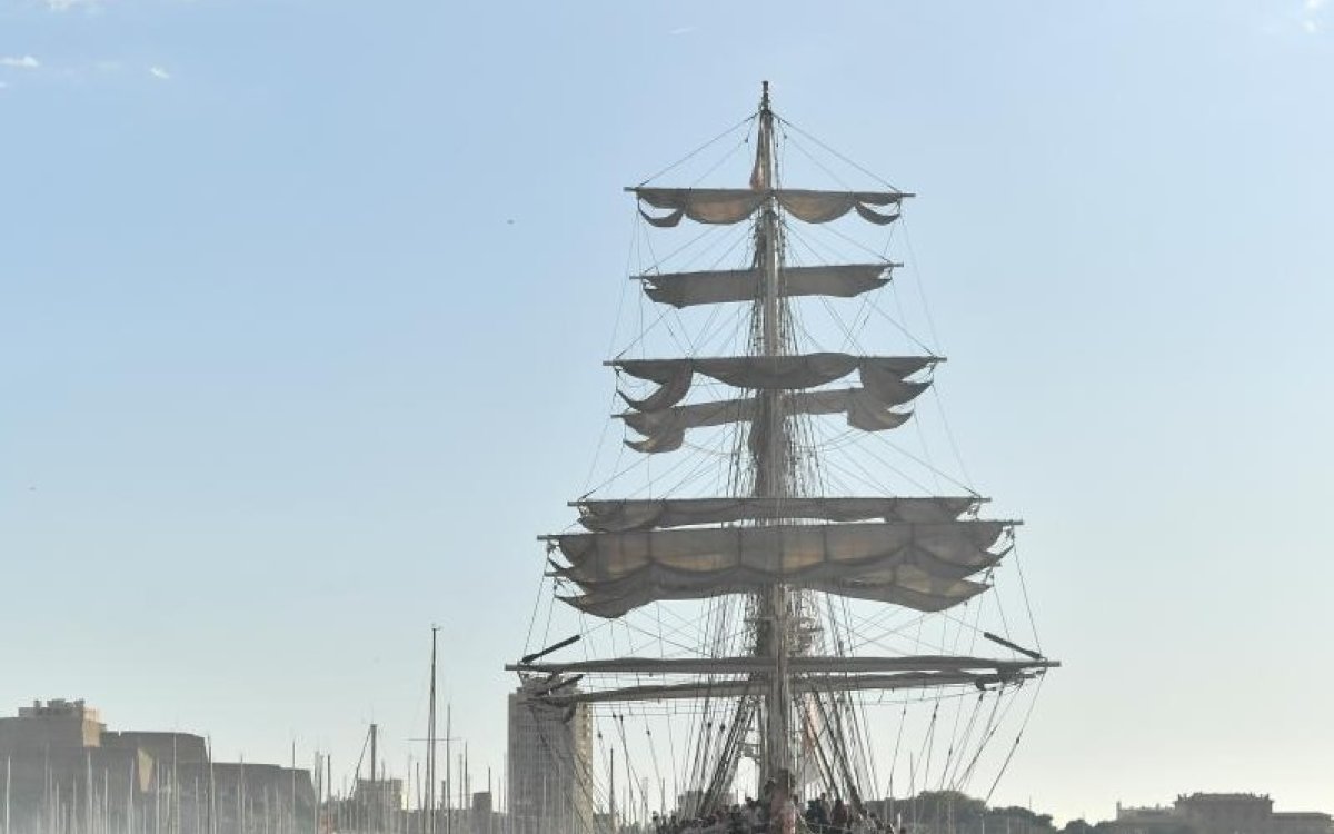 Olympic flame lands at Marseille Old Port amid fiery atmosphere